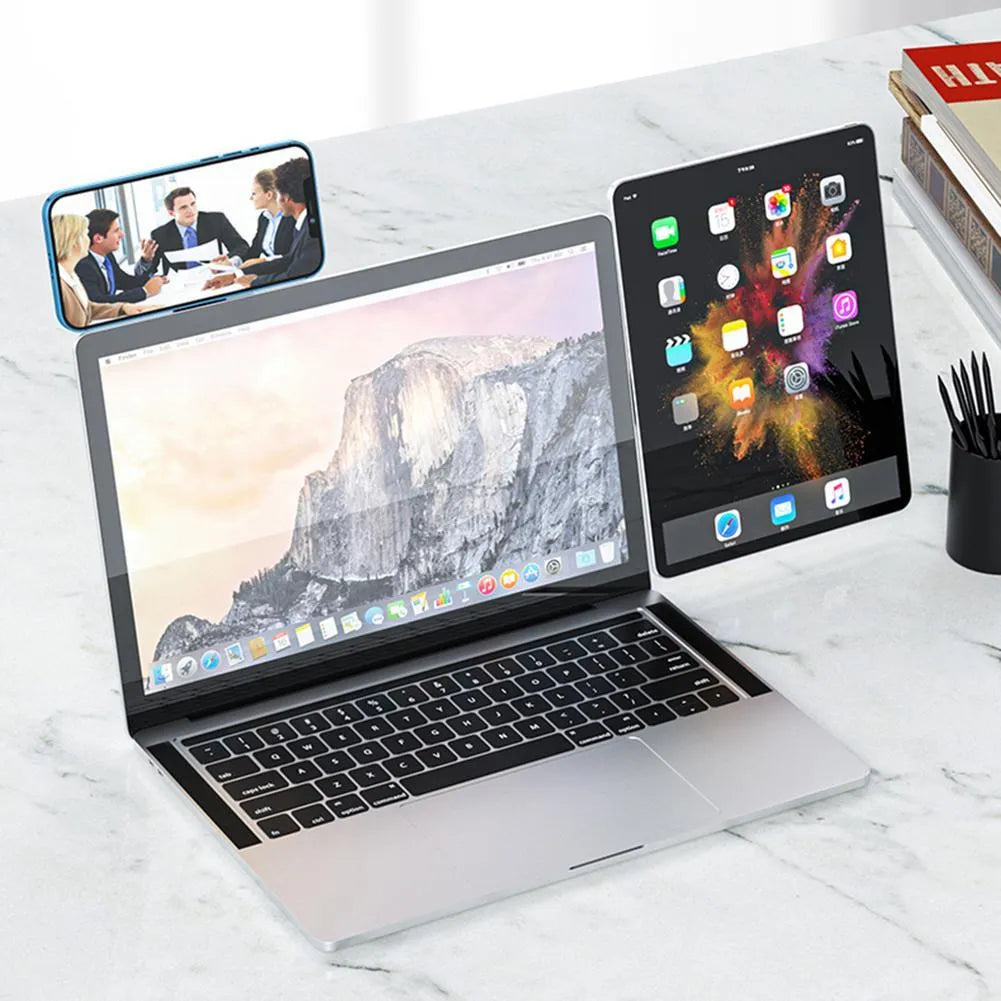 Black aluminium laptop phone holder mounted on computer monitor with smartphone attached