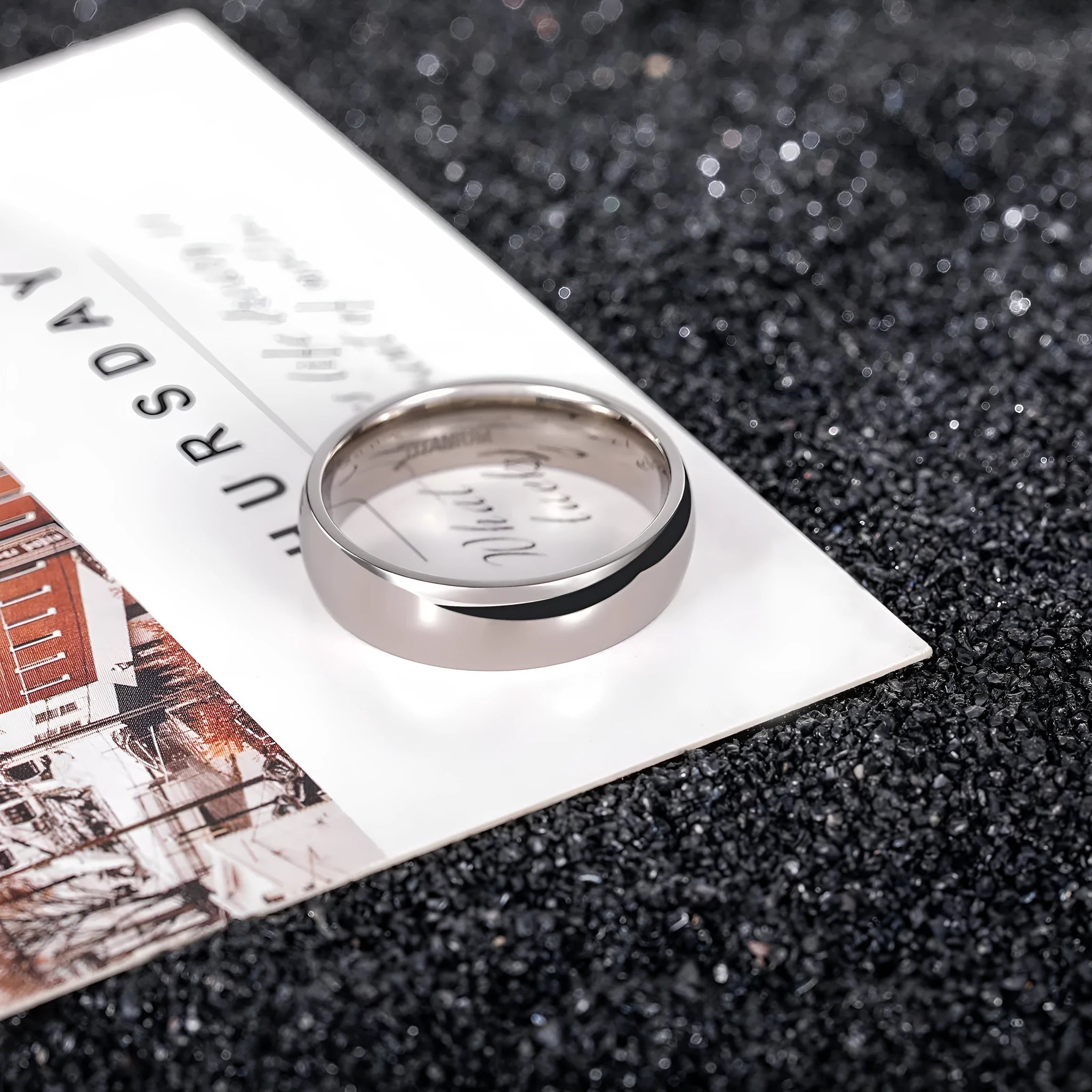 Silver titanium steel ring with matte grinding finish, shown in different width options on a finger.