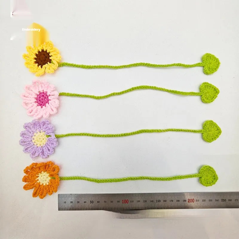 Hand-crocheted wool bookmark with daisy motif on flexible wire core