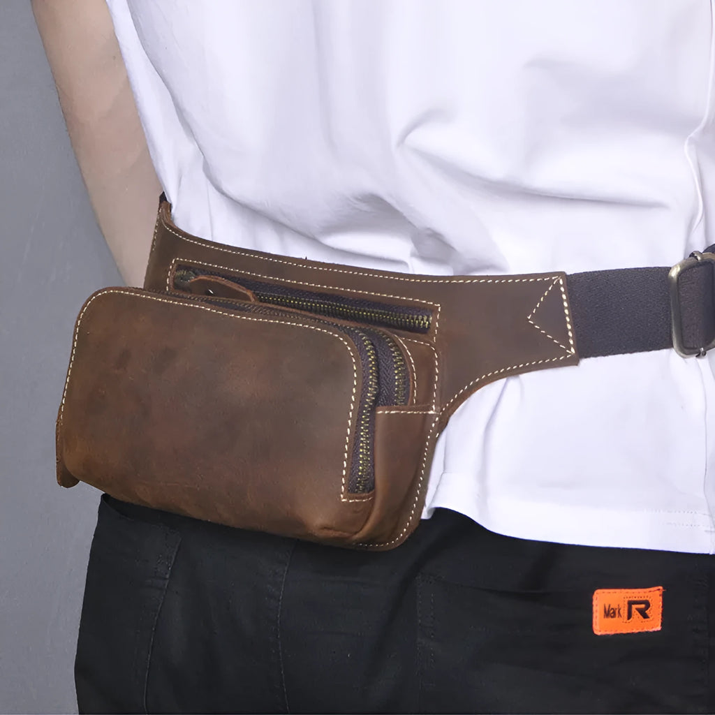 Brown top layer cowhide men's sports waist bag with pull closure, showing size and interior phone pocket.