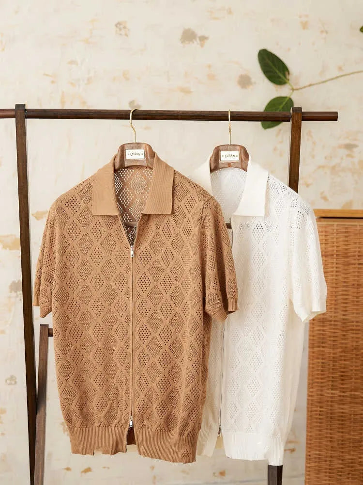 Man's light brown cotton cardigan with a front zipper, lapel collar, and short sleeves laid flat.