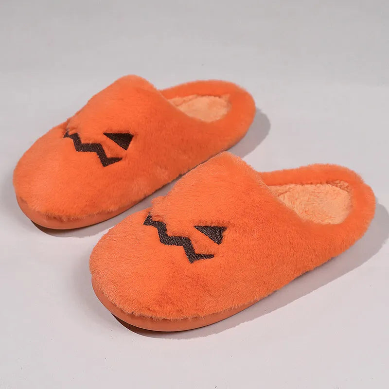 Orange Halloween pumpkin design plush slippers with a non-slip sole.