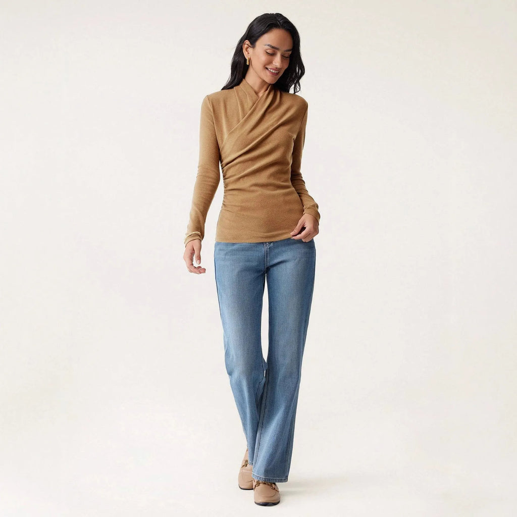 Camel-coloured slim-fit women's pullover sweater on a hanger.
