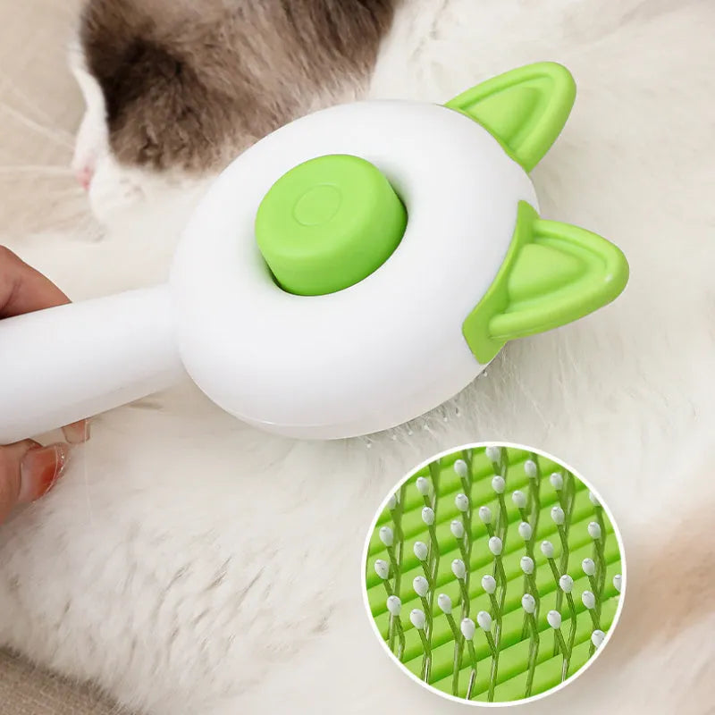Self-cleaning cat grooming comb with stainless steel teeth and removable brush head in greenish white colour