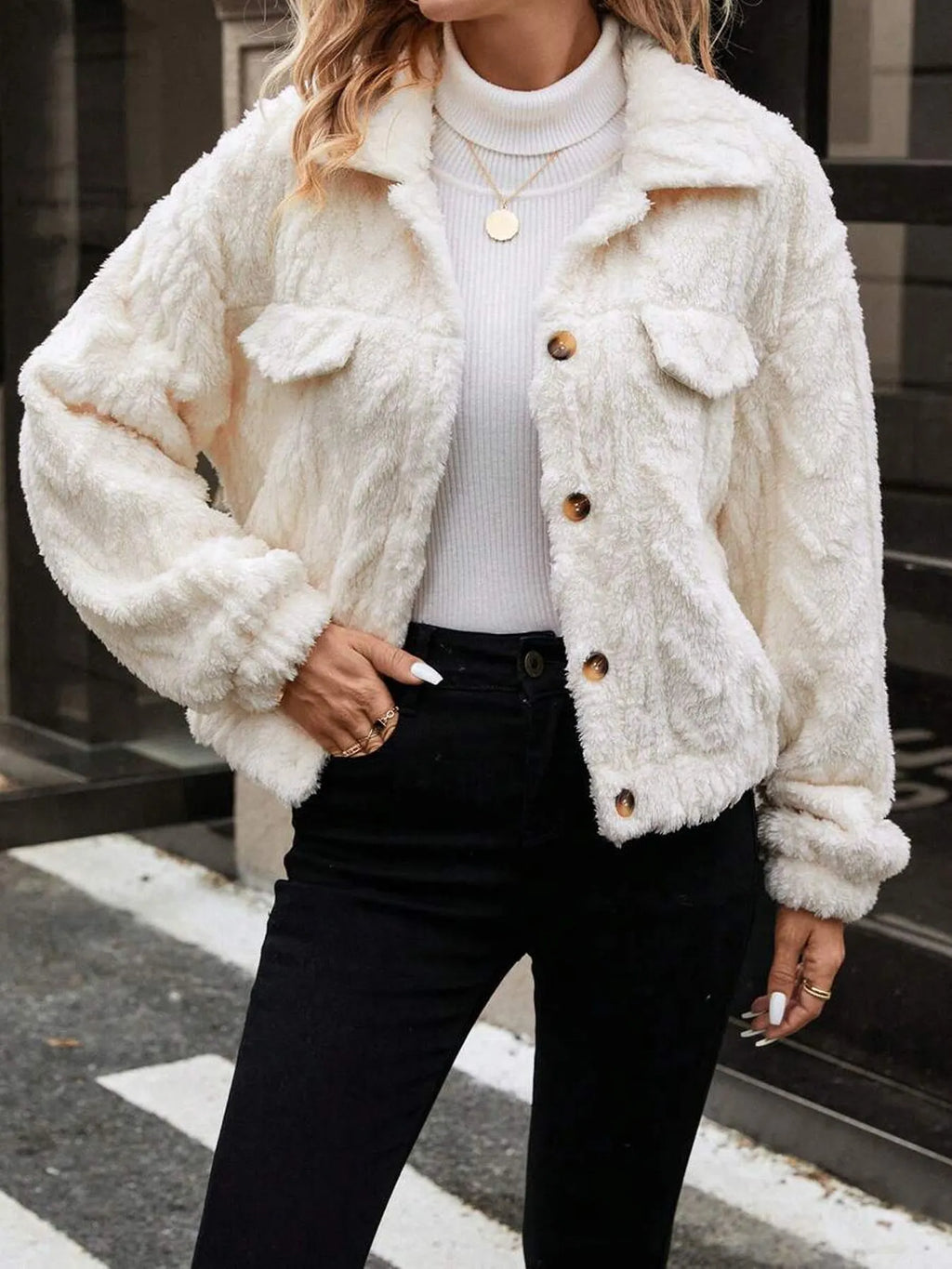 Ivory white women's plush cardigan coat with button front closure.