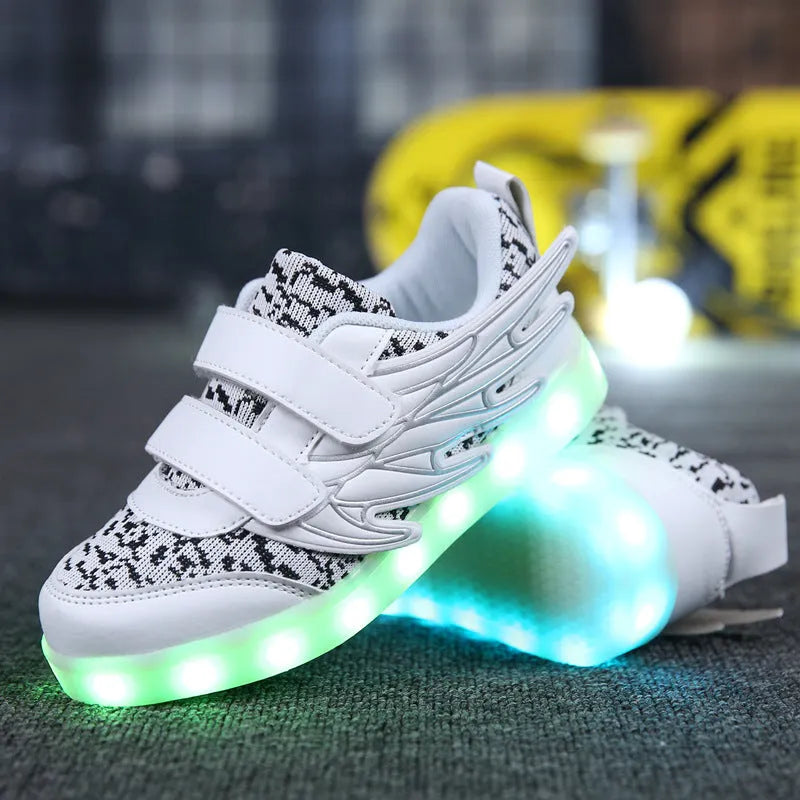 USB rechargeable children's LED light up trainers in plum red and white showing flashing soles.