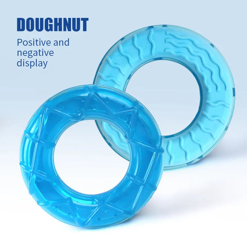 Set of three water-filled dog cooling toys: a blue pacifier, a red popsicle, and a green ring shape.