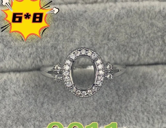 Oval denier ring with 6x8mm stone, open mouth design, and five-pointed star detail