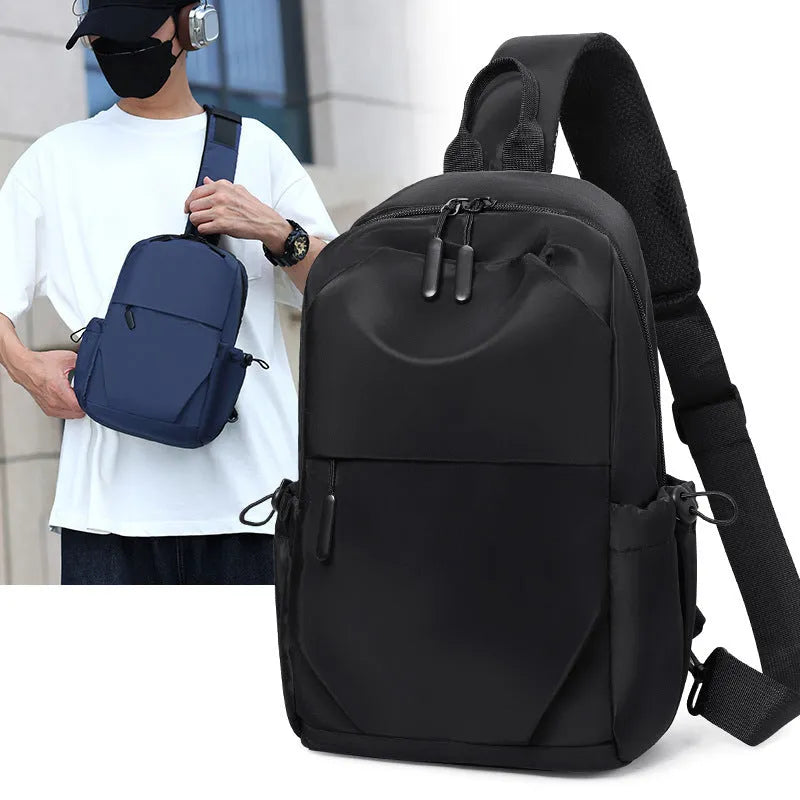 Grey men's chest bag with shoulder strap showing large main compartment.