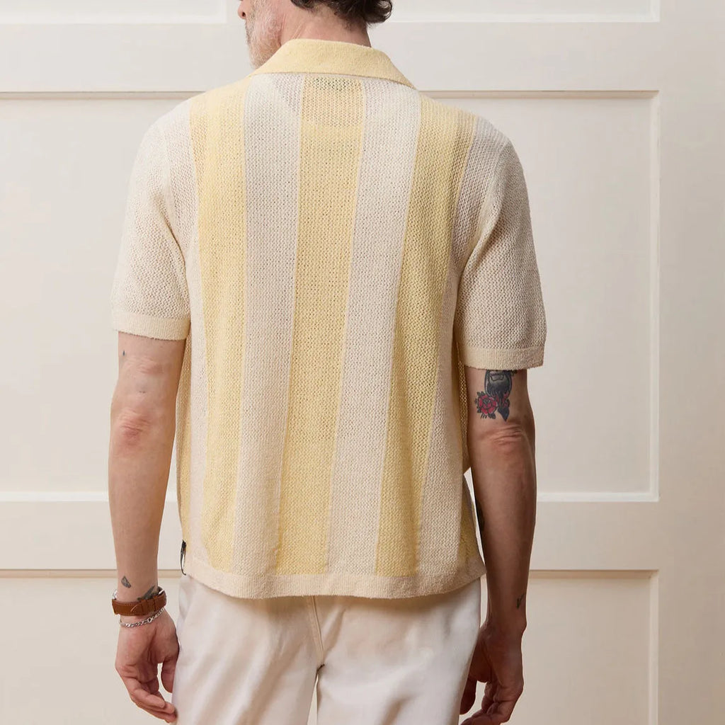 Yellow asymmetric casual polo shirt with hollow-out detail and short sleeves, made from Tencel fabric.