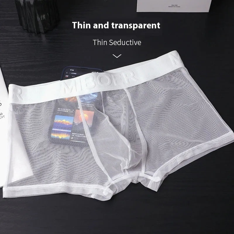 Men's solid colour thin polyester boxers in black, shown flat.