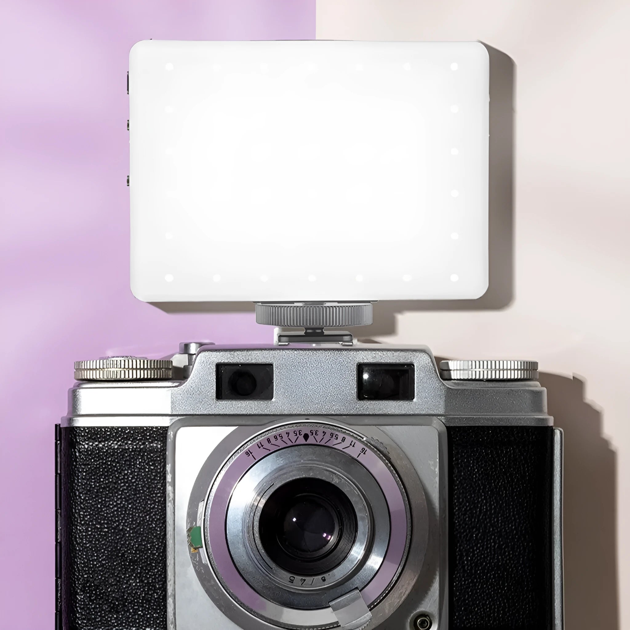 Portable LED fill light with clip attachment for mobile phone photography measuring 10.4 x 7.5 x 12.5 cm