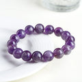 Natural purple crystal bracelet with scattered beads and Ruyi symbol design in various size options.