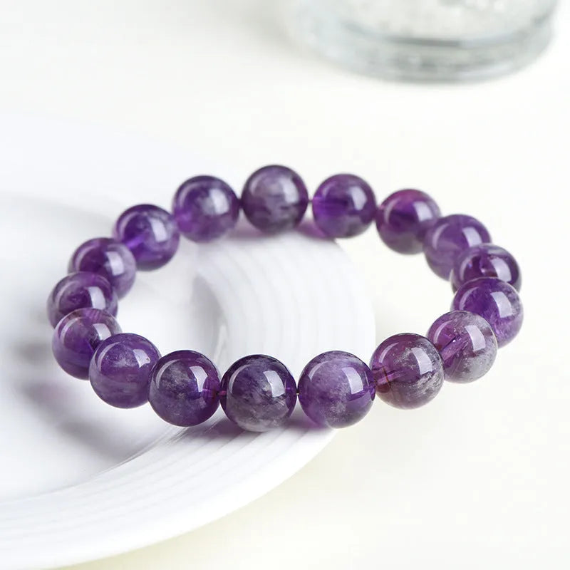 Natural purple crystal bracelet with scattered beads and Ruyi symbol design in various size options.