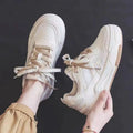 Women's pink low-top rubber sneakers with height-increasing soles and imitation leather lining