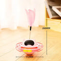 Pink plastic cat tumbler turntable toy with colourful balls measuring 17x10cm