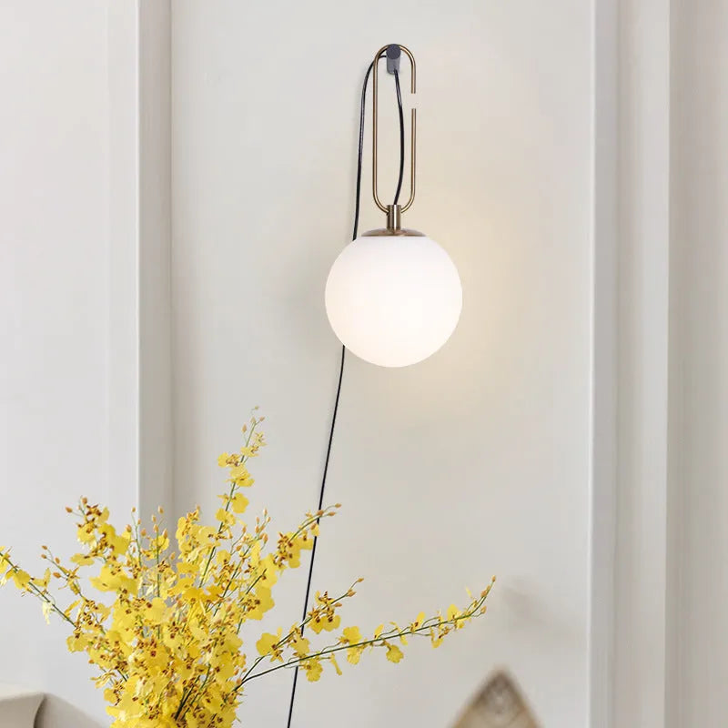 Modern clear glass wall lamp with dimmable LED light in three colour temperatures