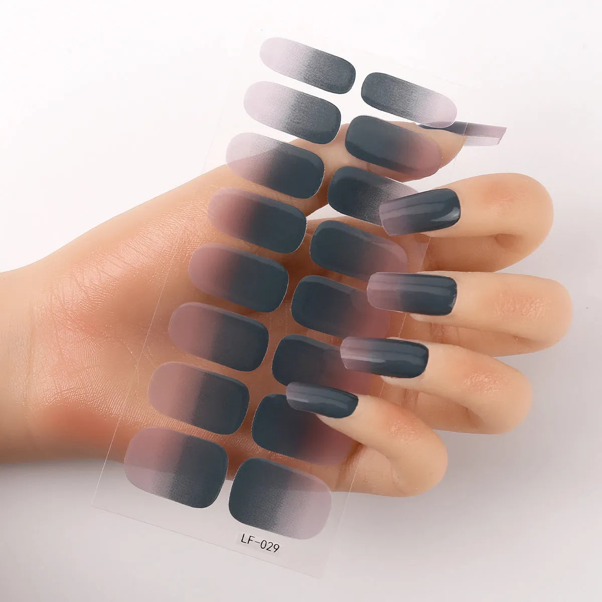 Full coverage nail art stickers sheet with 16 designs including cross, rose, tulip, and cartoon patterns.