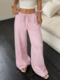 Women's wide leg trousers with lace-up waist detail in black or pink polyester fabric