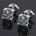 Silver geometric screw-back stud earrings with four-claw moissanite setting on black card
