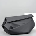 Grey PU men's crossbody sling backpack with a phone pocket on a mannequin.