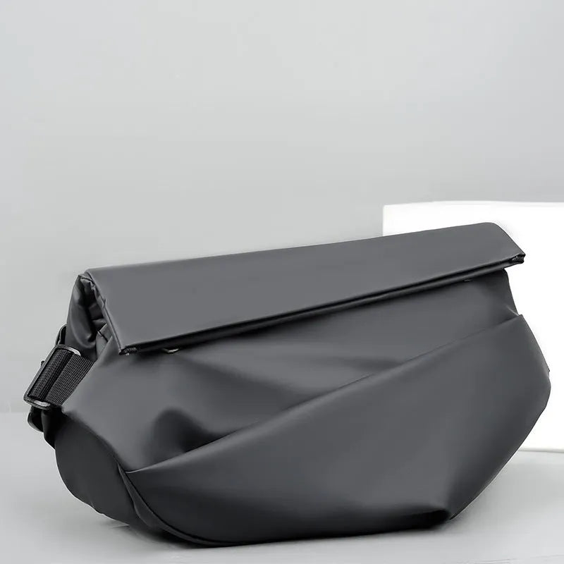 Grey PU men's crossbody sling backpack with a phone pocket on a mannequin.