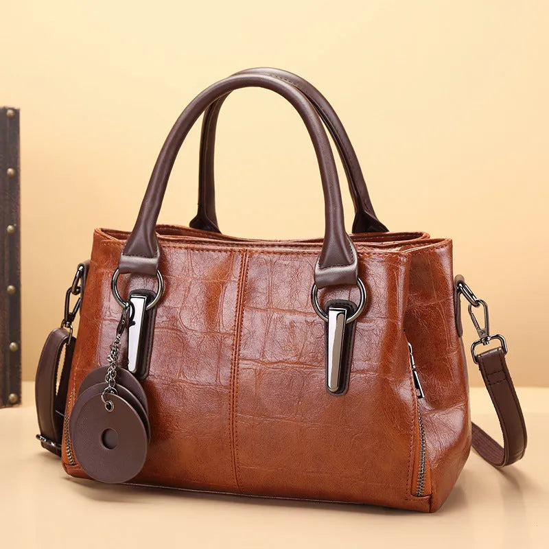 Horizontal square PU shoulder bag with open pocket and contrast stitching in black or brown colour options