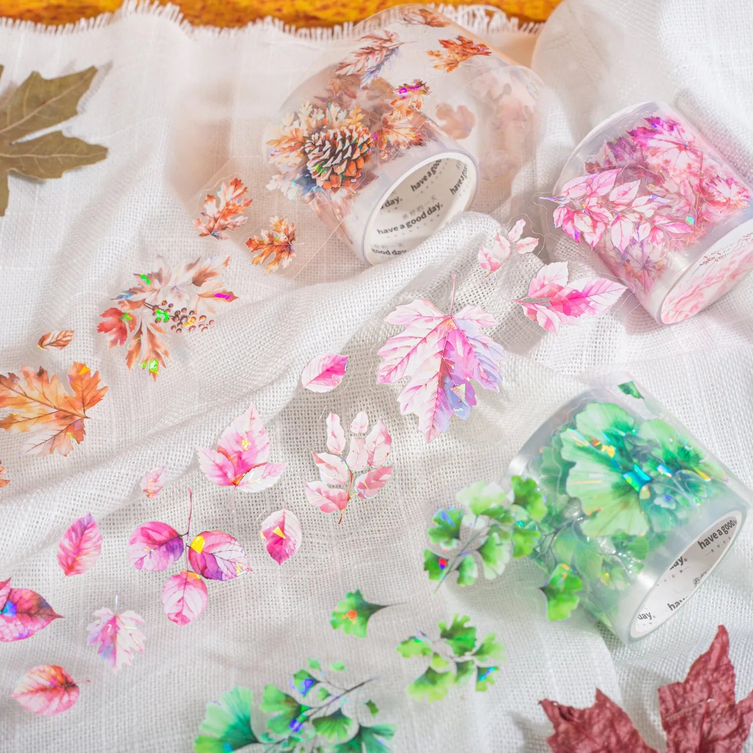 Six rolls of nature-themed decorative stickers showing gentle ginkgo, maple leaf, and blue fallen leaves colour variations