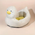 Duck-shaped fluffy pet bed for small dogs and cats in blue or white