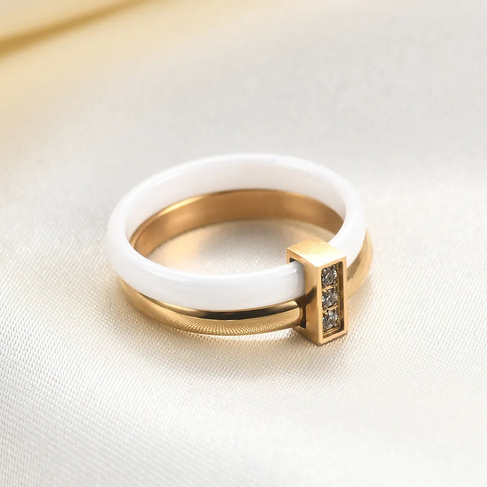 Ceramic ring with glossy stitching and inlaid zirconium in steel black or gold white colour, 6mm geometric shape