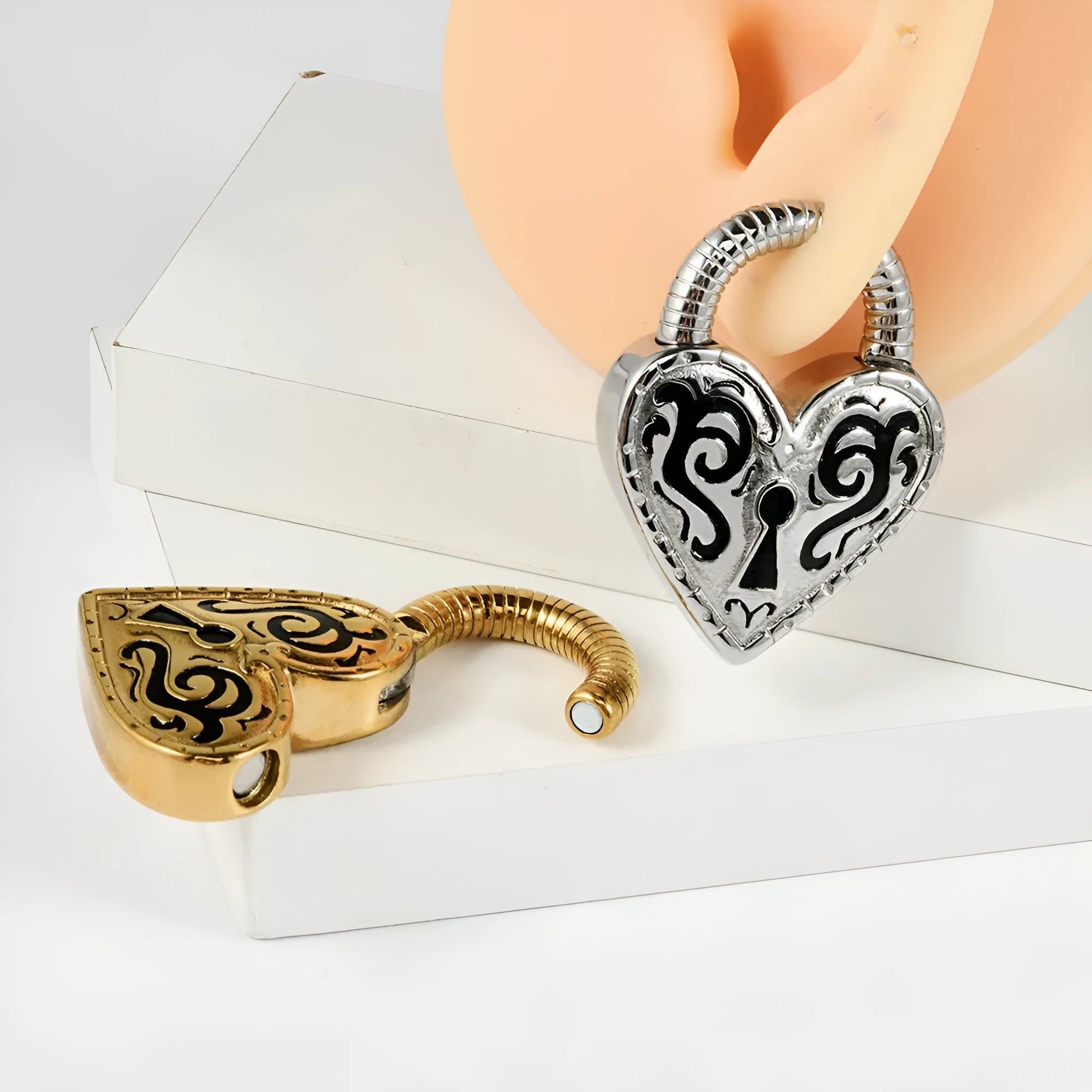 Heart-shaped stainless steel earrings with electroplated gold or steel colour finishes
