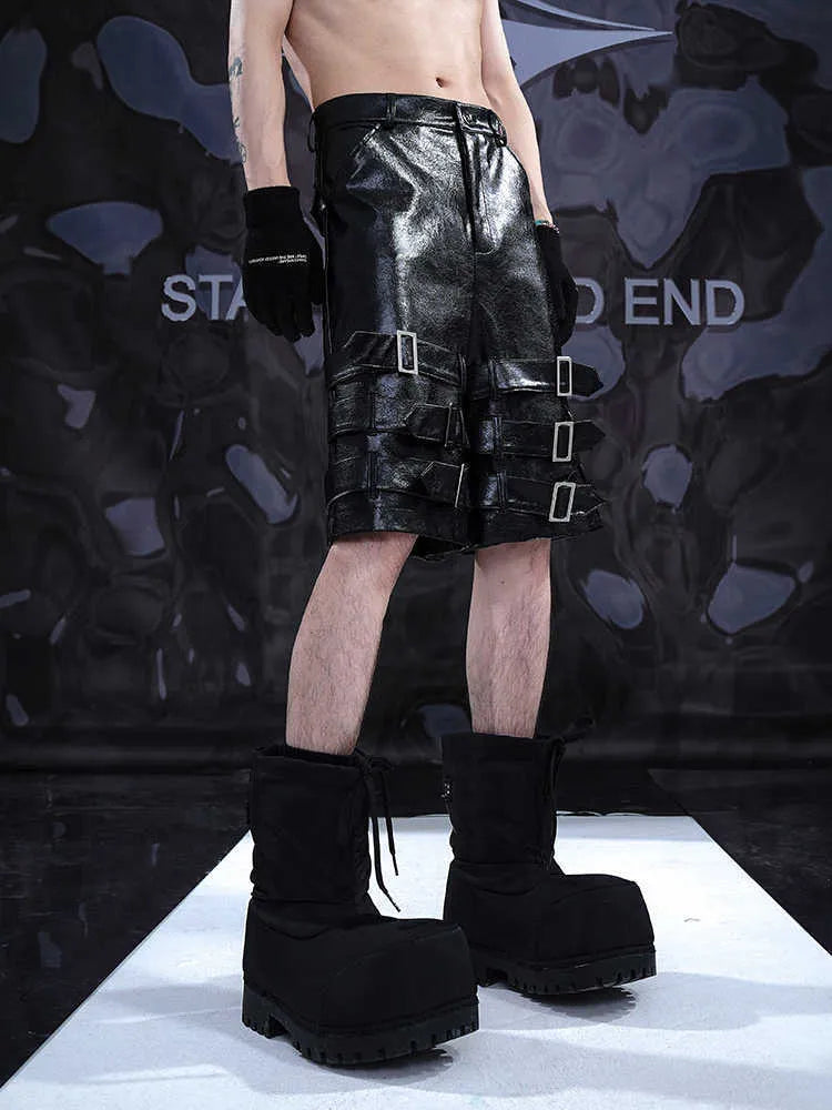 Men's black PU leather cropped shorts with medium-low waist design on hanger