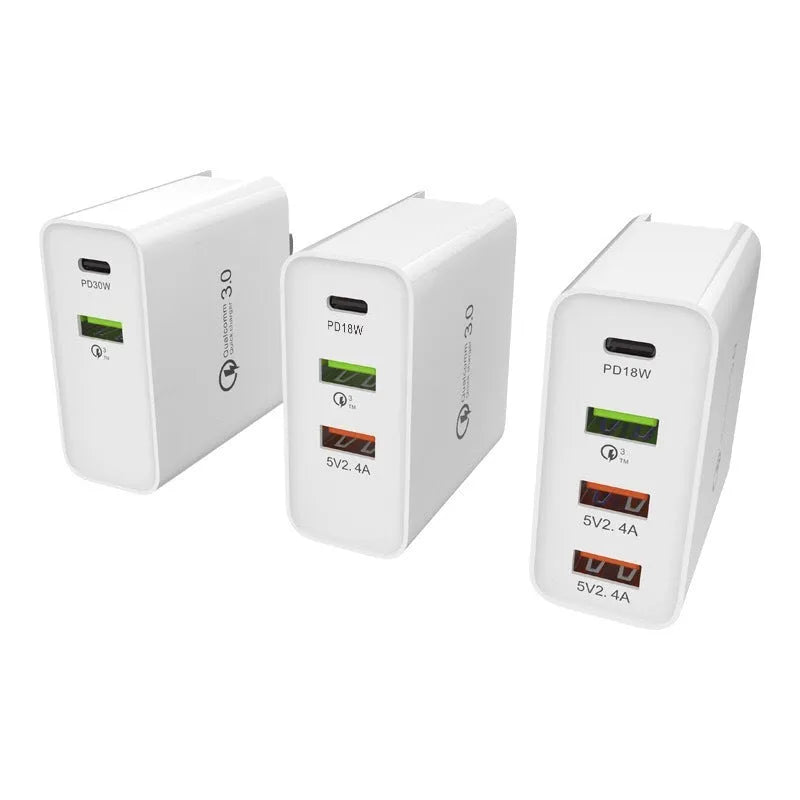 White fast charging mobile phone charger head with multiple USB ports and international plug adaptors