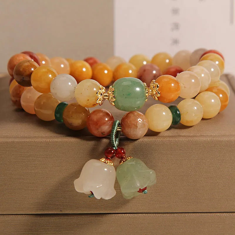 Natural Jinsi Jade multi-layer bracelet for women with orchid pendant on green background