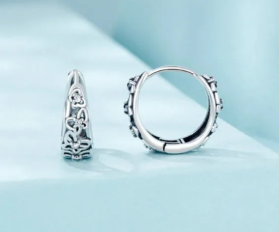 Retro hollow butterfly earrings in sterling silver with zircon accents, measuring 14mm by 5mm
