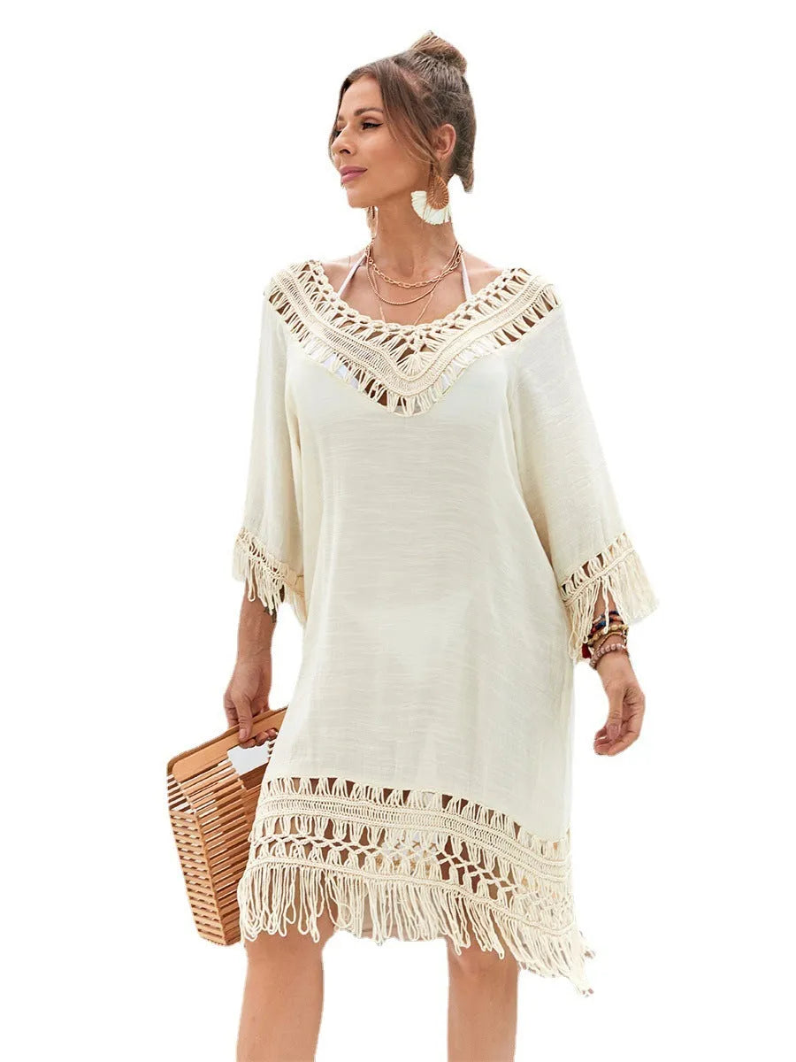 Apricot-coloured hand-crocheted beach dress for women on a mannequin.