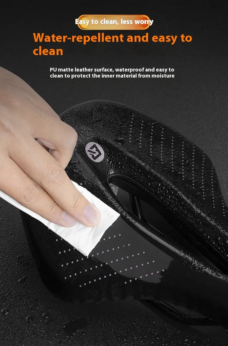 Medium black and pink bicycle seat cushion with PU foam padding for mountain bikes