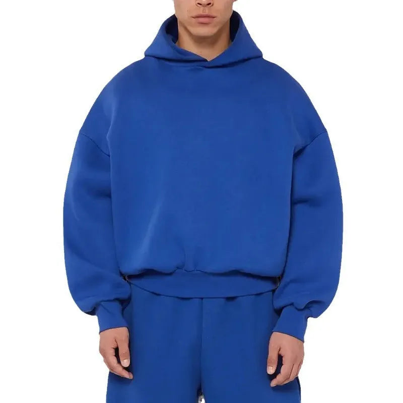 A grey men's fleece-lined cotton hoodie sweatshirt with a hood and long sleeves.