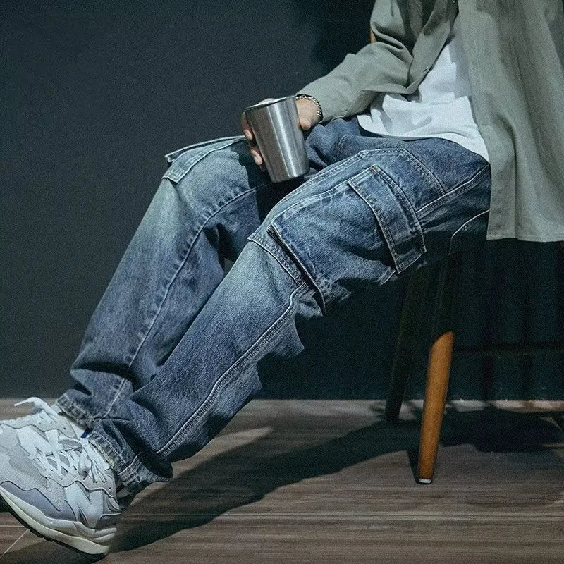 Blue men's loose straight-leg retro jeans with a zip fly, laid flat.