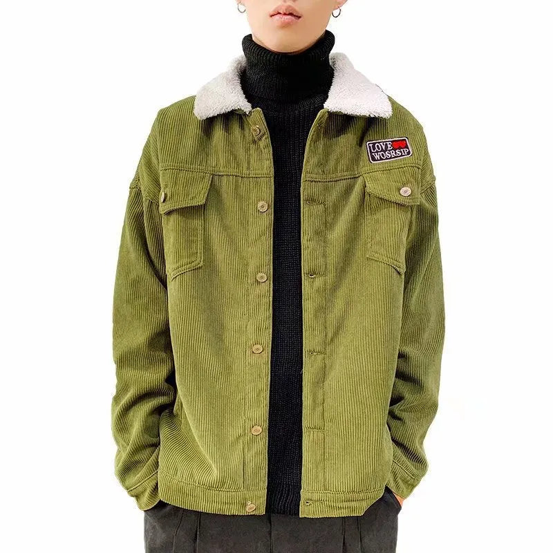 Man wearing a khaki coloured loose fit corduroy work jacket with stick pockets.