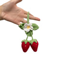Handmade strawberry-shaped car pendant made from knitted cotton and hemp wool.