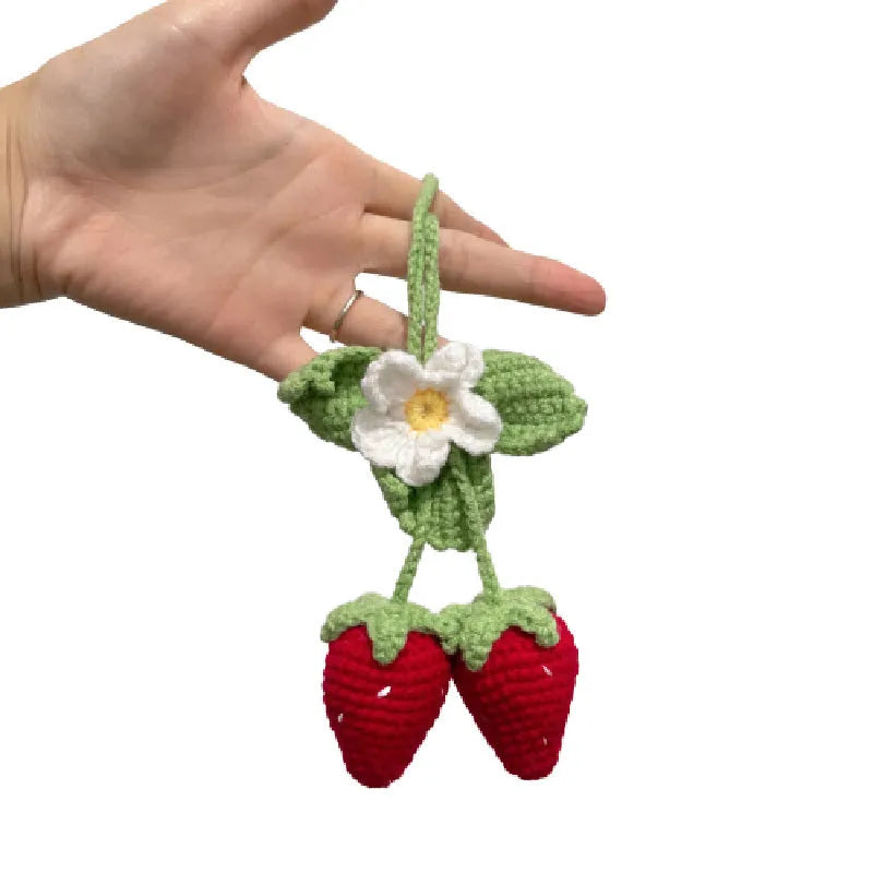 Handmade strawberry-shaped car pendant made from knitted cotton and hemp wool.