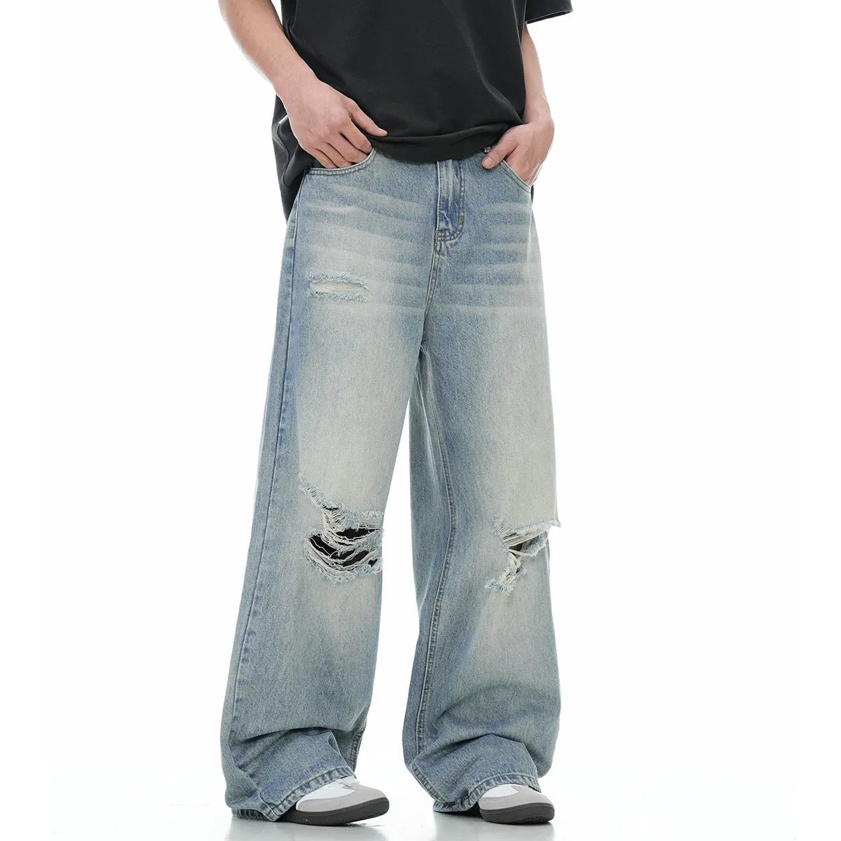 Men's blue straight-leg jeans with retro ripped distressing on the legs