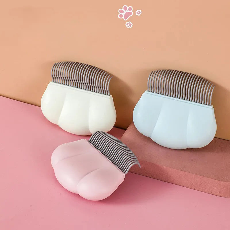 Blue Paw Soft deshedding brush for pets on a white background.