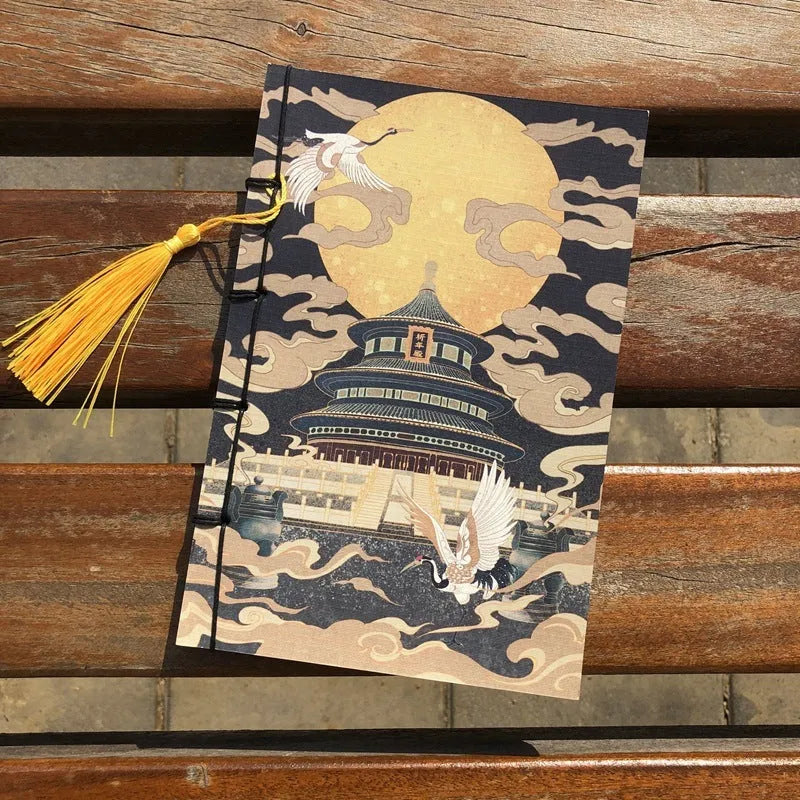A5 antique wire-bound notebook with retro painting cover, thread binding, and black tassels.