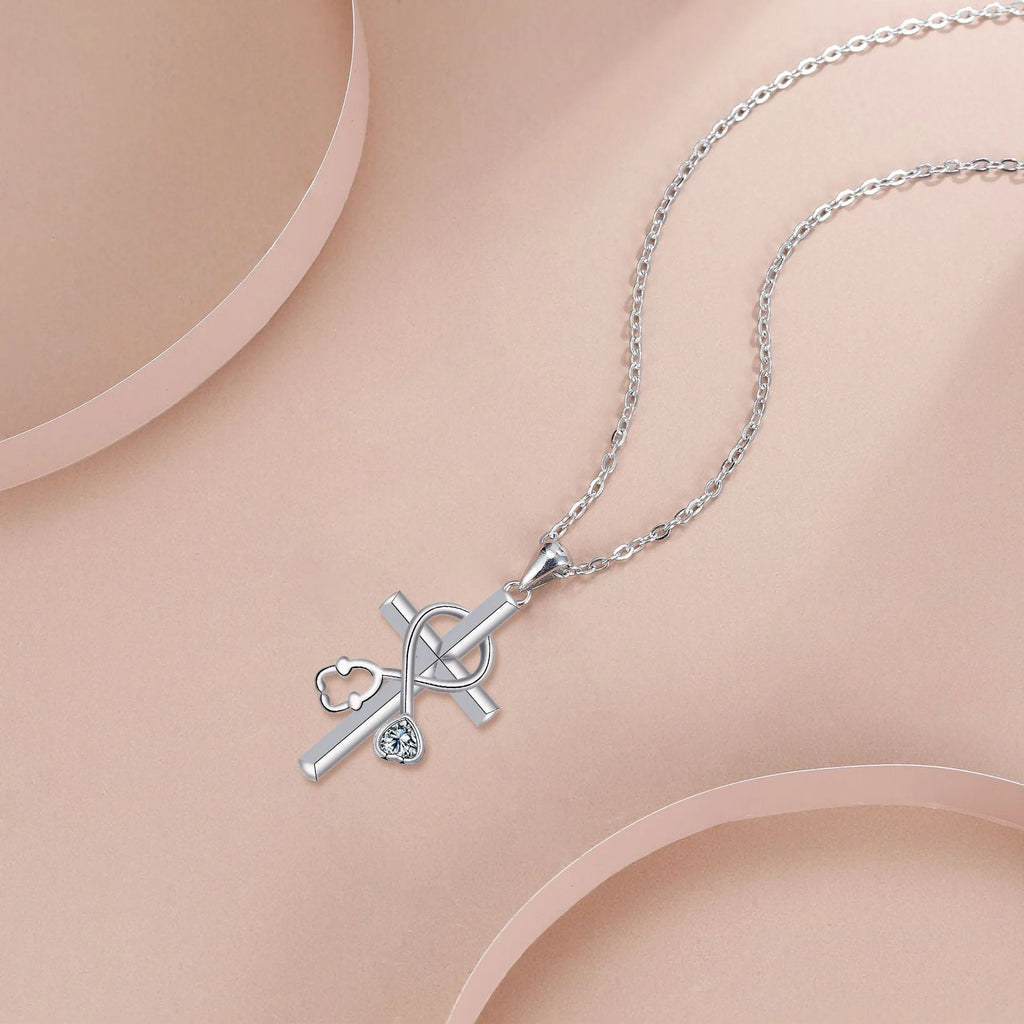 Close-up of a copper stethoscope pendant necklace on a cross-link chain for women.