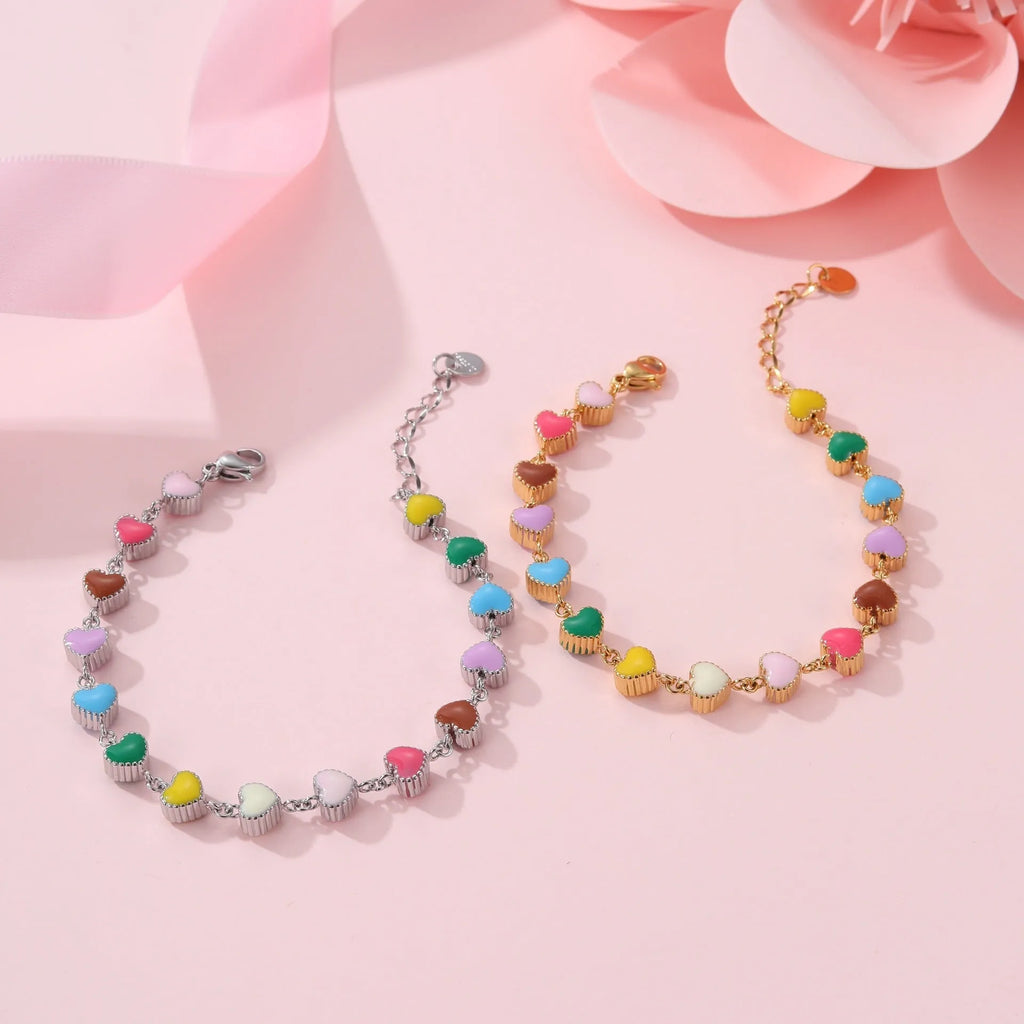 Women's titanium steel bracelet with love heart pendant in gold or steel electroplated finish