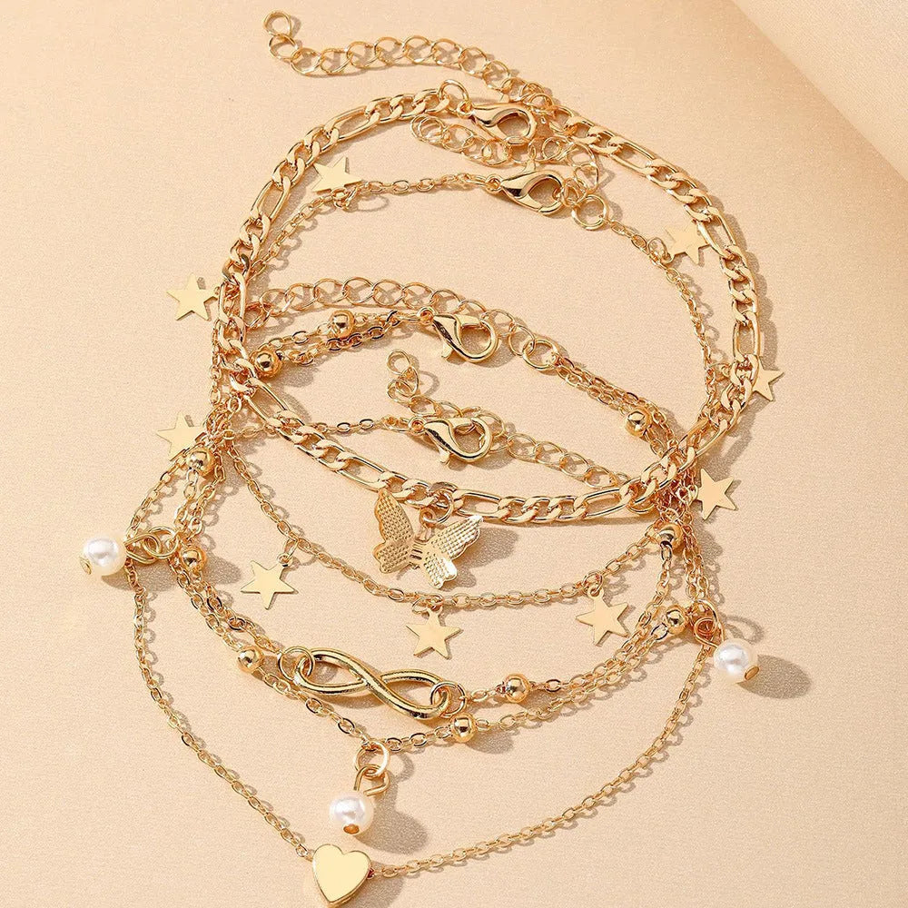 Four-piece butterfly pearl heart anklet set with layered alloy foot chains