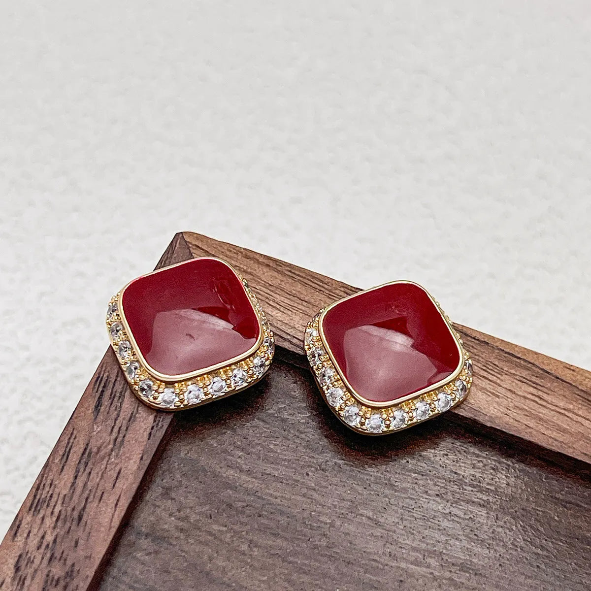 Red square-shaped alloy earrings for women with geometric design and Seiko-treated finish.