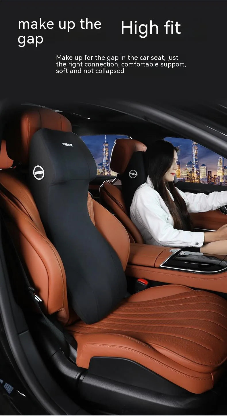 Black automotive memory foam cushion and lumbar support pillow set on a car seat.